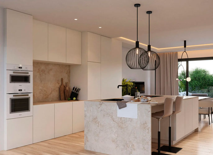 A beautiful kitchen with a sleek and modern design. The room is flooded with natural light from large windows, and the marble countertops gleam in the sunlight.